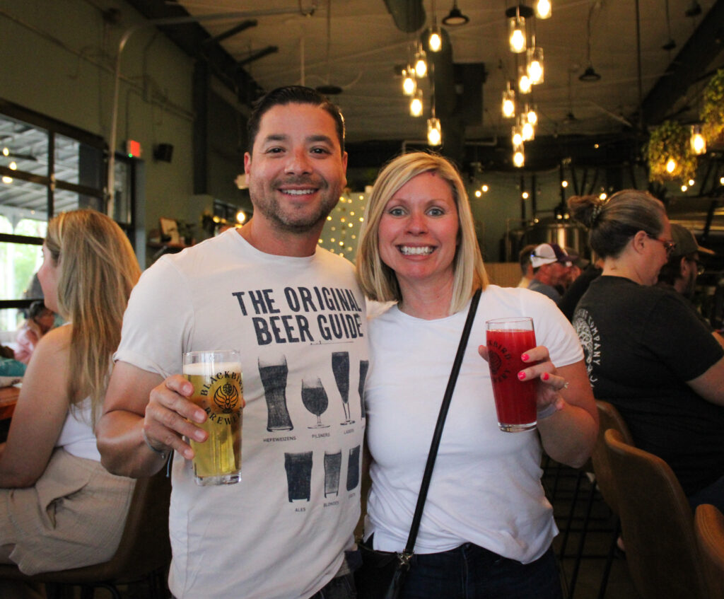 Couple in taproom with beer