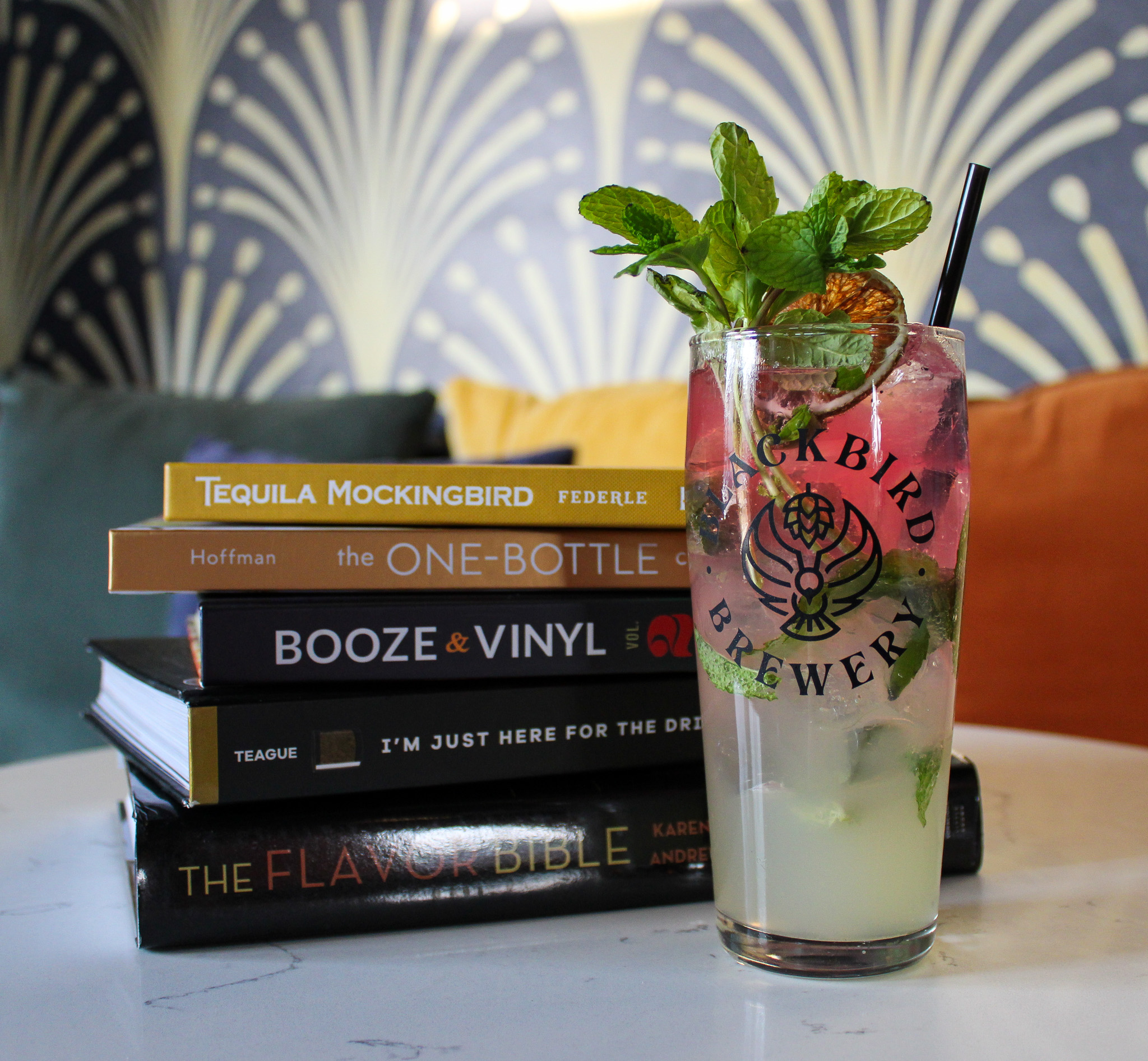 Stack of Books and a cocktail